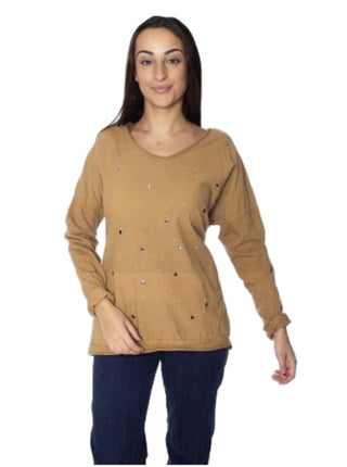 Woman wearing a brown top with decorative elements on a white background