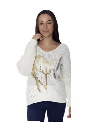 Woman wearing a white sweater with decorative elements on a white background