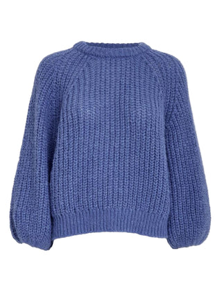 Blue knitted sweater on a light gray background