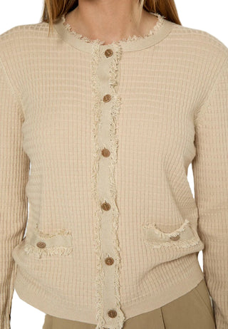 Beige textured cardigan with button details on a plain background