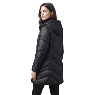 A woman wearing a black hooded puffer jacket with a chevron quilted pattern, shown from a three-quarters back view against a solid gray studio background.