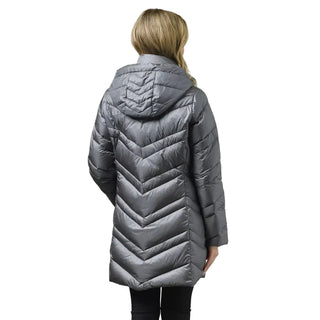 A woman viewed from the back wearing a medium gray hooded puffer jacket with a quilted chevron pattern, set against a solid light gray studio background.