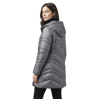 A woman wearing a gray hooded puffer jacket with a chevron quilted pattern, shown from a side-back angle against a solid gray studio background.