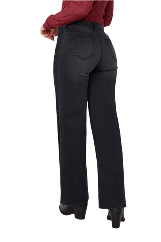 Person wearing black pants on a white background