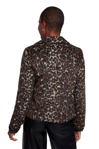 Person wearing a leopard print jacket on a white background