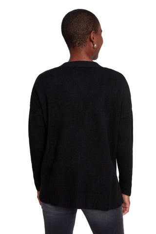 Person wearing a black sweater on a white background