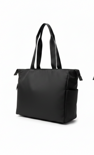Two black tote bags shown side by side on a clean white background, featuring dual shoulder straps and zip-top closures.