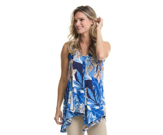 Woman wearing a blue floral sleeveless top on a white background