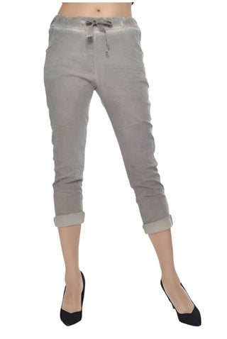 Gray jogger pants worn by a person on a white background