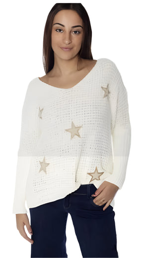Woman wearing a white sweater with star patterns on a white background