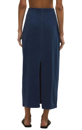 Navy blue pants worn by a person on a beige background