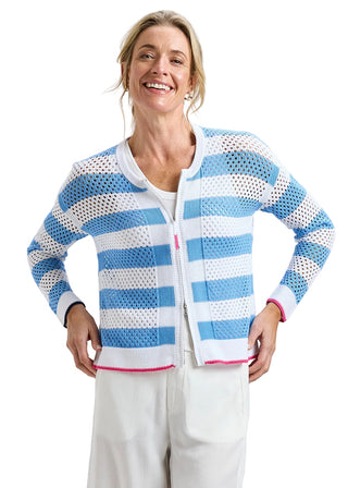 Woman wearing a blue and white striped sweater against a plain background