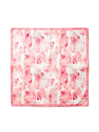 Pink and white patterned fabric square on a white background