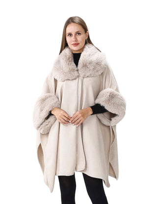 Woman wearing a beige coat with fur trim on a white background