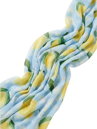 Floral patterned fabric with yellow flowers and green leaves on a white background