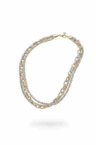 A double-layered chain necklace displayed on a black mannequin bust. The necklace features one layer of silver-tone chain links and one layer of mixed gold and silver-tone chain links, with some links on the gold layer embellished with small clear stones.