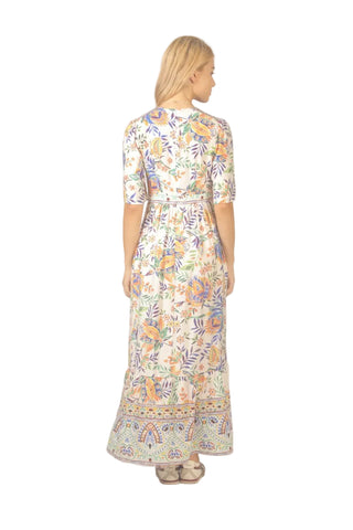 Woman wearing a floral dress on a plain background