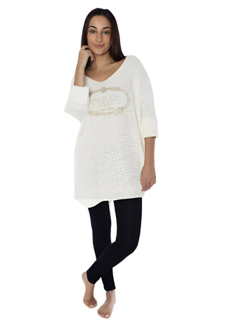 Woman wearing a white off-shoulder top with a logo and black leggings on a white background, with 'Amorosa' branding.