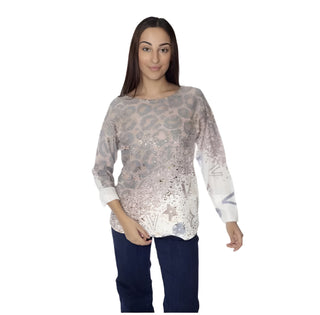 Woman wearing a patterned blouse with 'Amorosa' branding on a white background